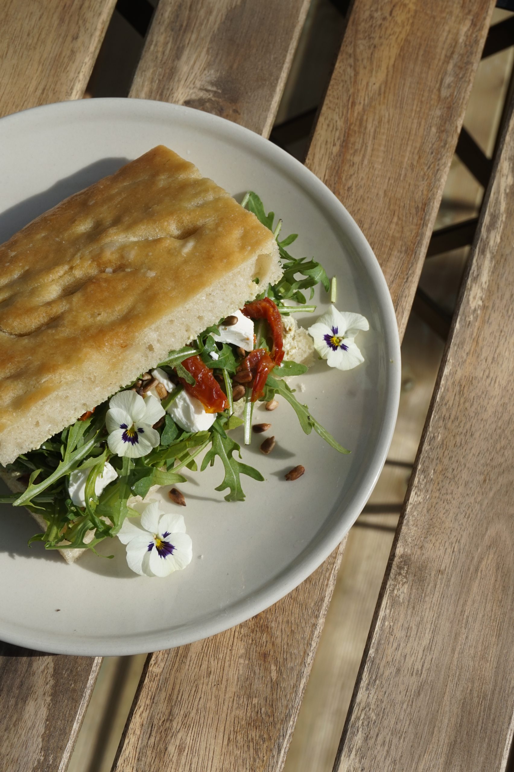 Focaccia sandwich with edible flowers